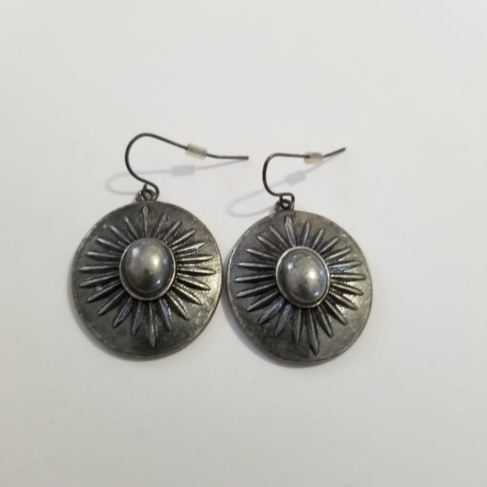 silver tone starburst dangle earrings